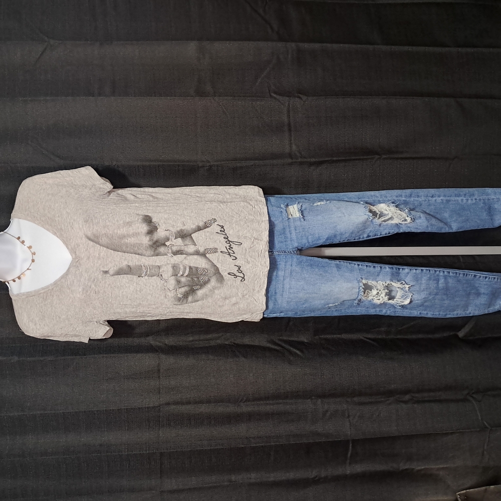 Gray Graphic T-Shirt and Distressed Blue Jeans
